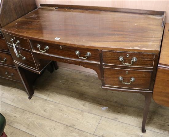 A mahogany bowfront dressing table, W.117cm